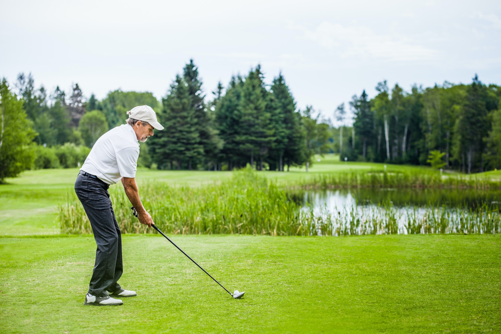 mature golfer on a golf course