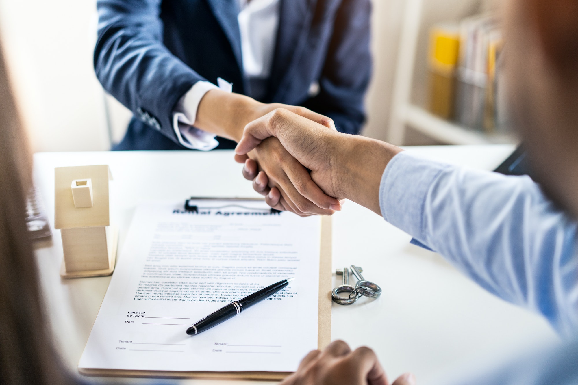 successful handshake of man customer and house agency