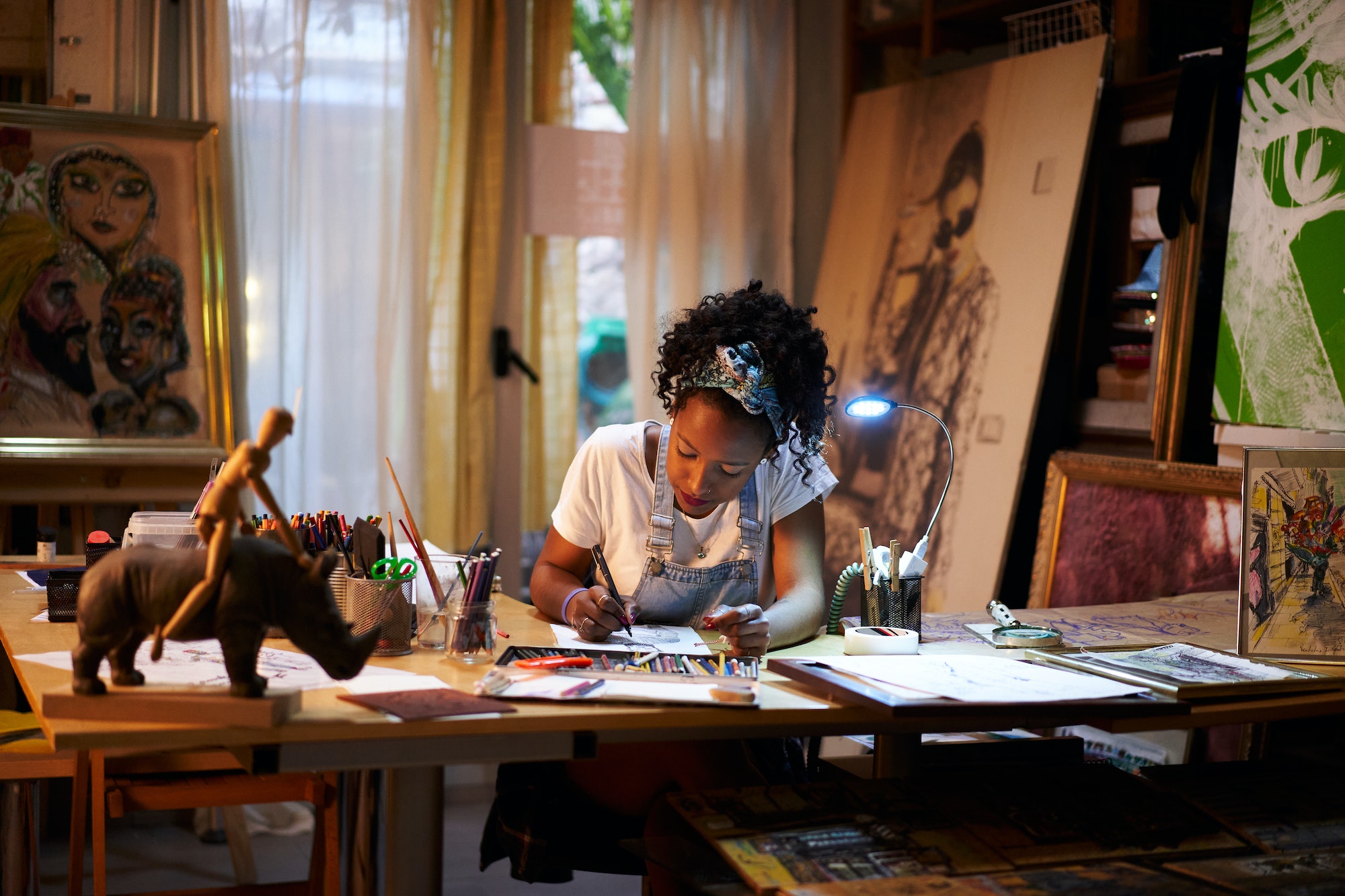 young african american artist at work in the studio creative person making art